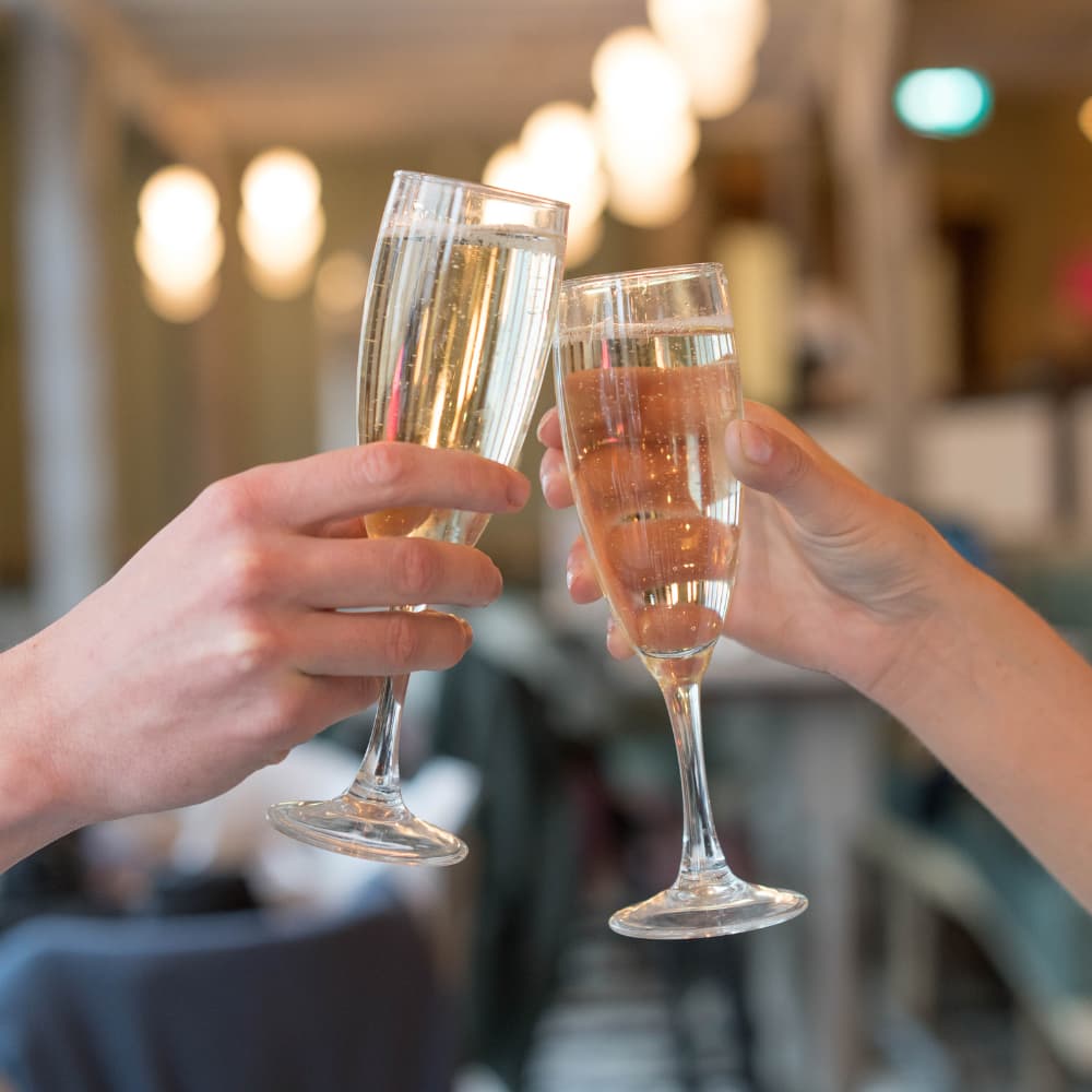 Clinking glasses | Slug & Lettuce