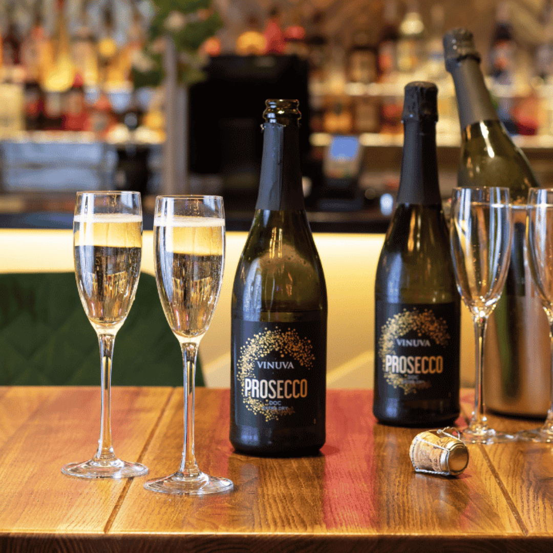 Bottles of prosecco on a table at S&L
