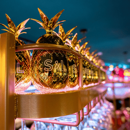 Golden pineapples on a shelf at Slug and Lettuce Golden pineapples on a shelf at Slug and Lettuce