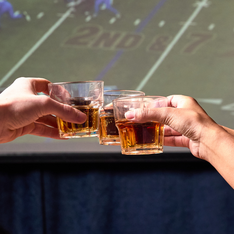 3 people cheersing Jager Bombs