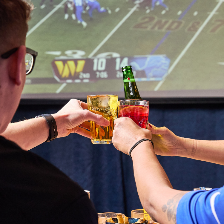 3 people cheersing drinks